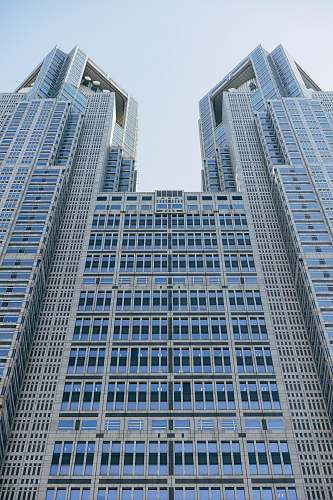 high rise white and blue concrete building town